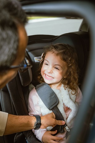 IMAGE-Smiling-Toddler-in-Car-Seat.jpg